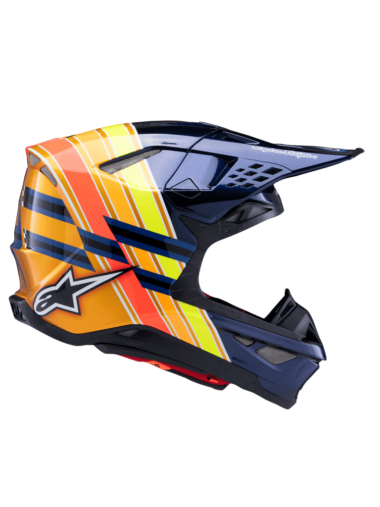 Alpinestars Supertech M10 TLD Edition 25 Helm, Motocross-Helm, Dunkles Metallic-Blau mit leuchtenden orangefarbenen, gelben und roten Streifen, Seitenprofilansicht, glänzendes Finish mit Alpinestars- und Troy Lee Designs-Branding, aerodynamische Schale mit mehreren Mesh-Belüftungsöffnungen für den Offroad-Rennsport