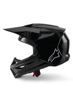 Alpinestars S-M3 Solid Helm, Motocross-Helm, Schwarz glänzend, Seitenansicht, mit silbernem Alpinestars-Logo, aerodynamischem Visier und mehreren Belüftungsöffnungen für den Offroad-Rennsport