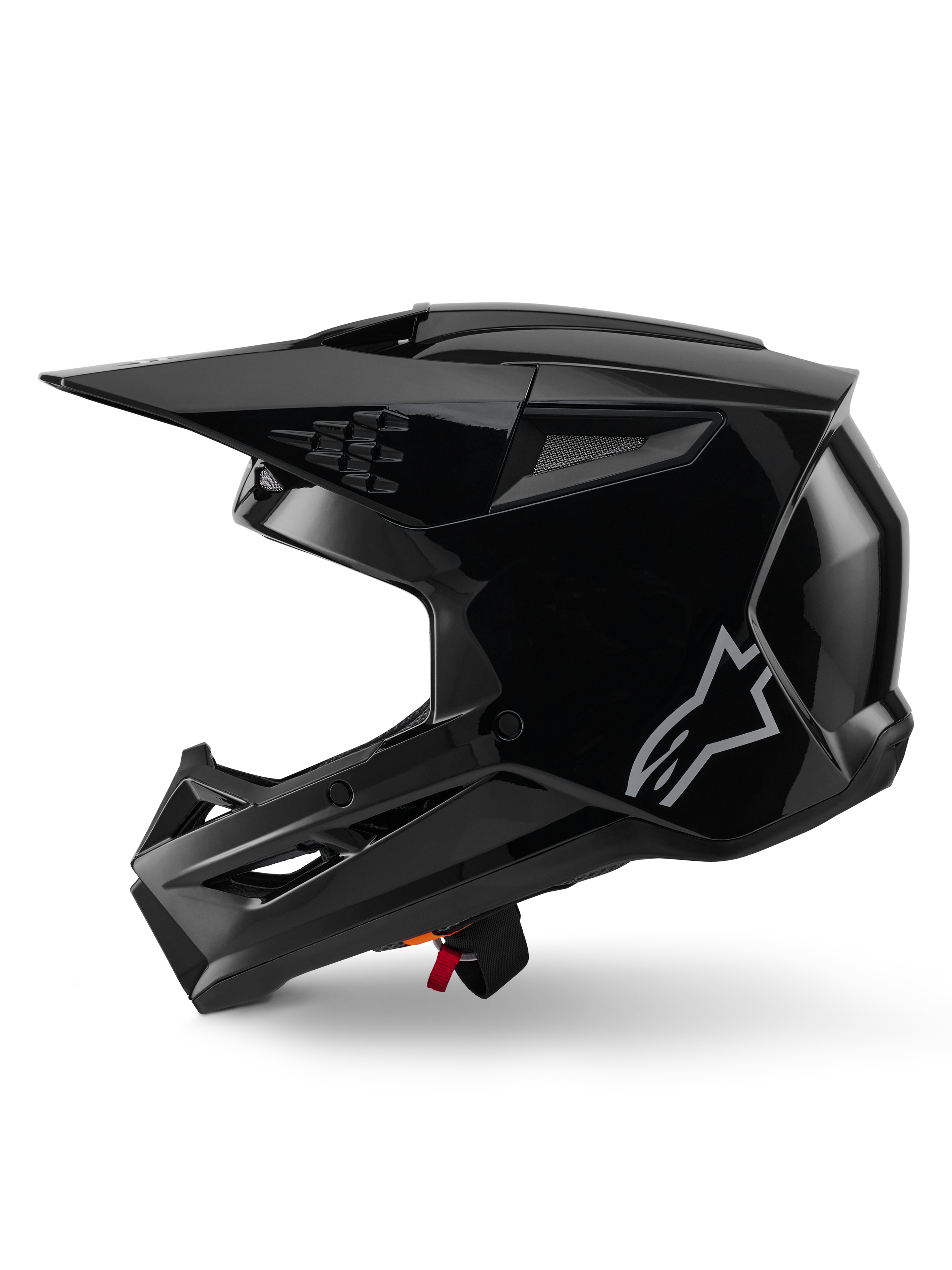 Alpinestars S-M3 Solid Helm, Motocross-Helm, Schwarz glänzend, Seitenansicht, mit silbernem Alpinestars-Logo, aerodynamischem Visier und mehreren Belüftungsöffnungen für den Offroad-Rennsport