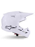 Alpinestars S-M3 Solid Helm, Motocross-Helm, Glänzend Weiß, Seitenansicht mit schwarzem Stern-Logo, kantige aerodynamische Schale, mehrere Belüftungsöffnungen, integriertes Visier und Kinnschutz, Offroad-Rennschutz