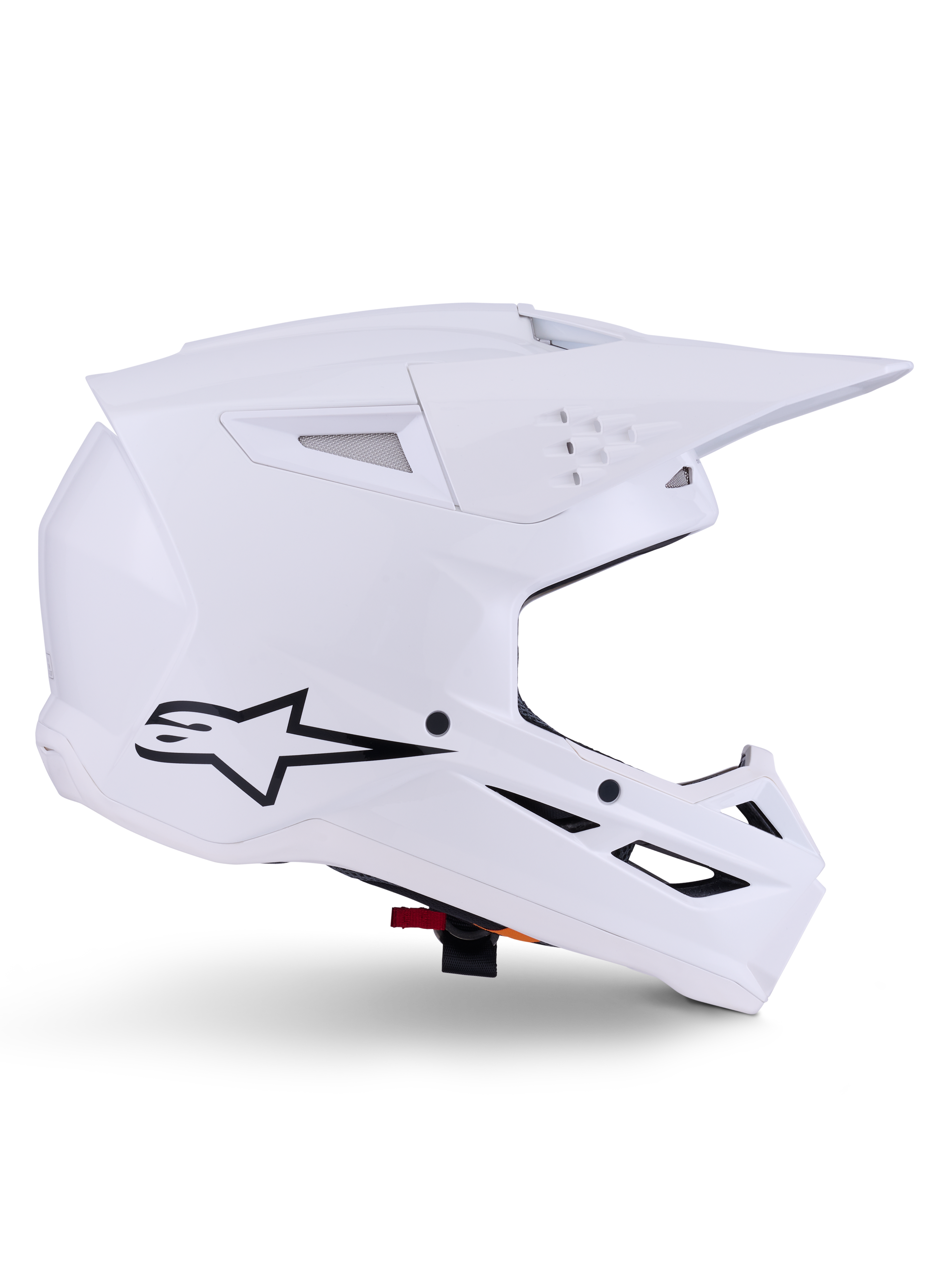 Alpinestars S-M3 Solid Helm, Motocross-Helm, Glänzend Weiß, Seitenansicht mit schwarzem Stern-Logo, kantige aerodynamische Schale, mehrere Belüftungsöffnungen, integriertes Visier und Kinnschutz, Offroad-Rennschutz
