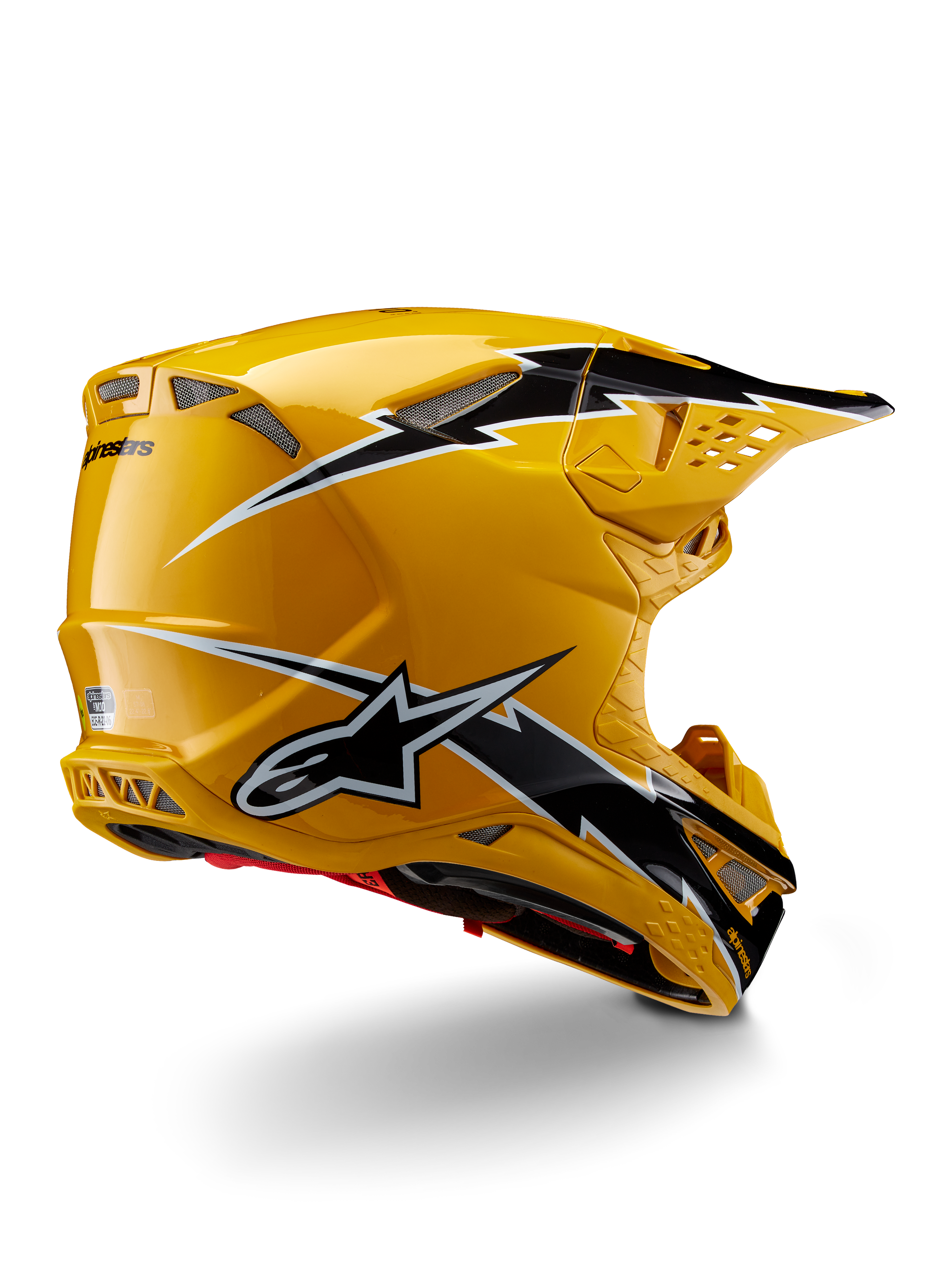 Alpinestars Supertech M10 Ampress Helmet, Motocross Helmet, Black Yellow Glossy, featuring a high-gloss yellow finish with black and white lightning-style graphics, rear three-quarter view showing aerodynamic shell and integrated ventilation ports.
