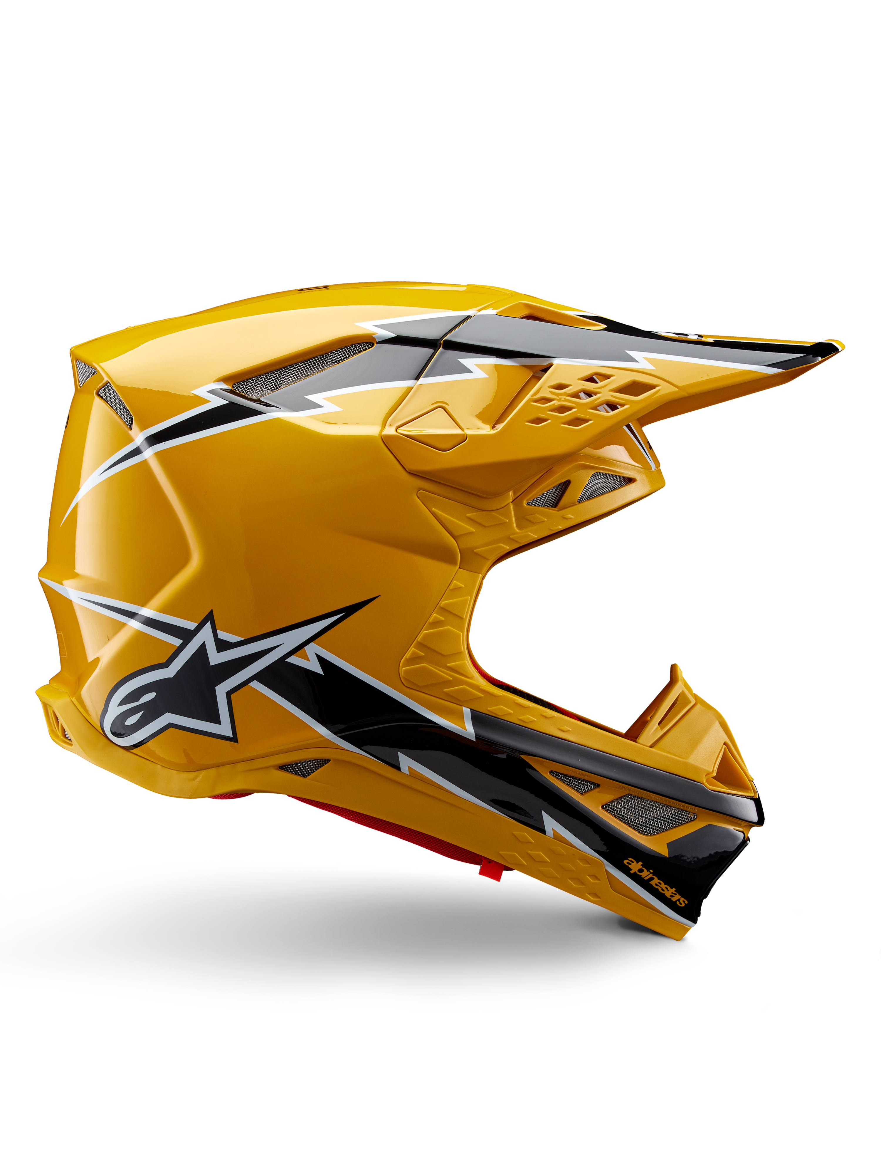 Alpinestars Supertech M10 Ampress Helm, Motocross-Helm, Schwarz und Gelb glänzend, Seitenprofil mit markanten schwarz-weißen Blitzgrafiken, Alpinestars Stern-Logo, aerodynamisches Design mit integrierten Belüftungsöffnungen und verstellbarem Visier.