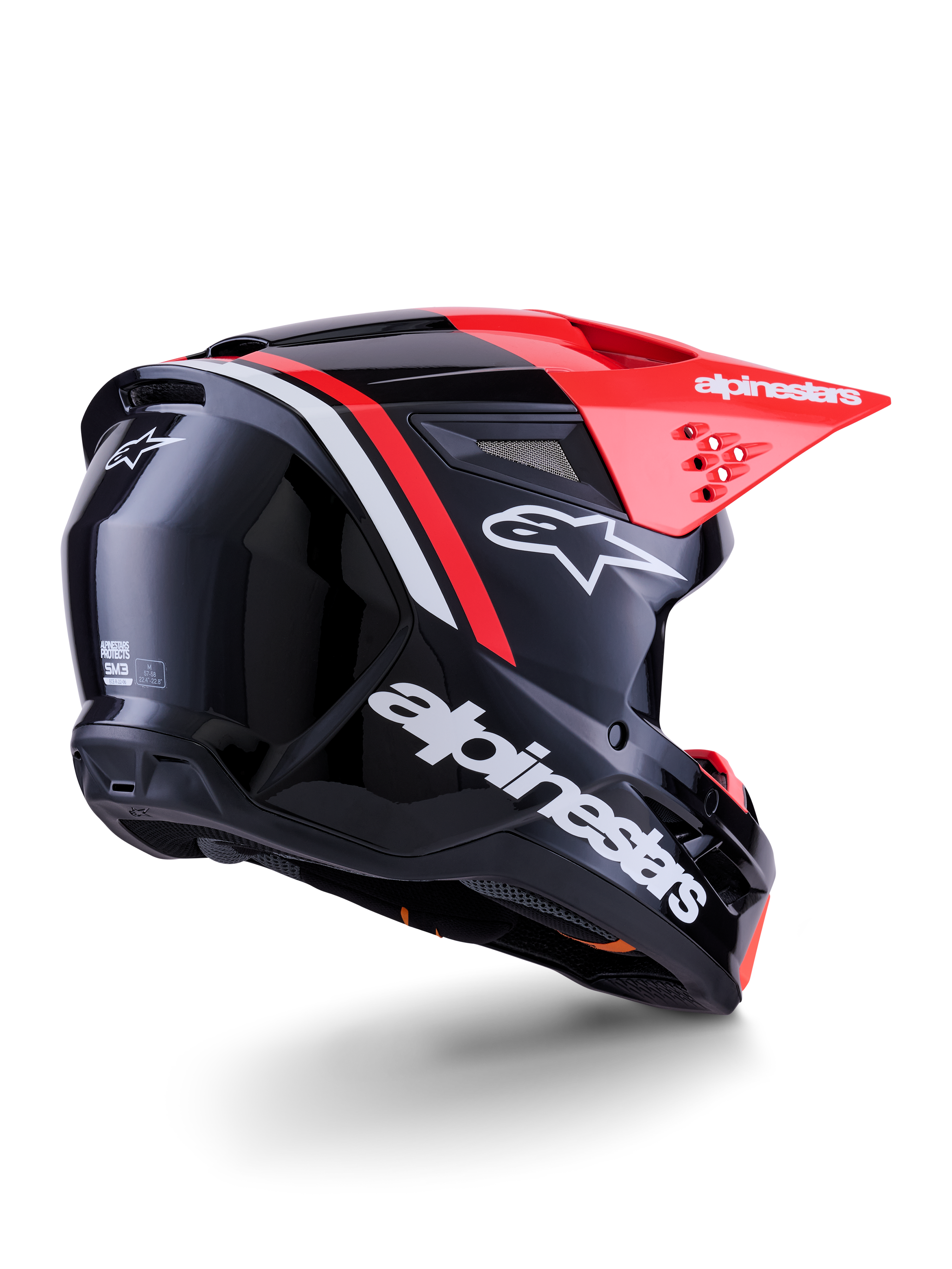 Alpinestars S-M3 Radium Helm, Motocross-Helm, Schwarz, Fluo-Rot und Weiß Glänzend, Rückansicht in Dreiviertel-Perspektive zeigt schlankes aerodynamisches Design, weißes Branding und leuchtend rotes Visier, Hochleistungs-Offroad-Schutzkopfbedeckung