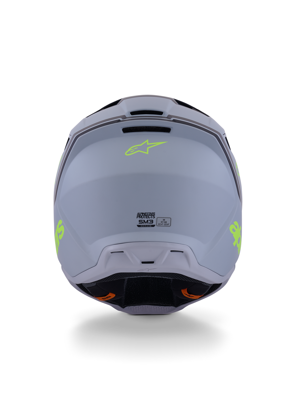 Alpinestars S-M3 Radium Helm, Motocross-Helm, Grün, Schwarz und Gelb Fluo Matt, Rückansicht mit matter Schalenoberfläche, neongelbem Alpinestars-Logo und ECE 22.06-Zertifizierungsdetails.