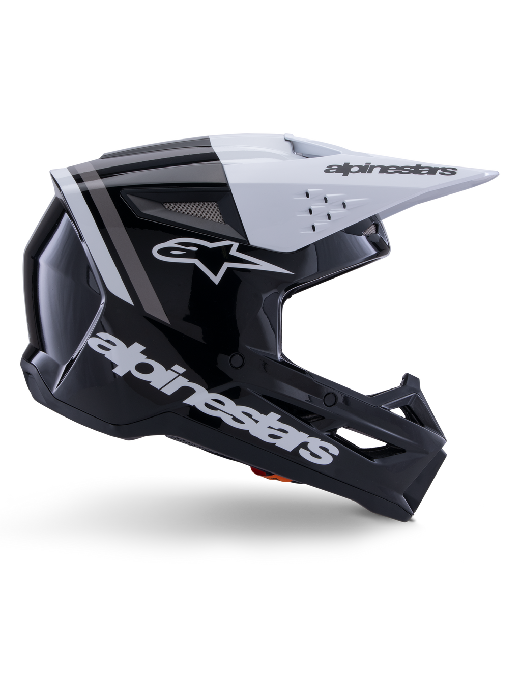 Alpinestars S-M3 Radium Helm, Motocross-Offroad-Helm, Schwarz, Weiß und Grau glänzend, mit einem kantigen aerodynamischen Design und Belüftungsöffnungen, Seitenansicht, glänzende Oberfläche mit grauen Streifen und ein weißes Visier mit Alpinestars-Branding