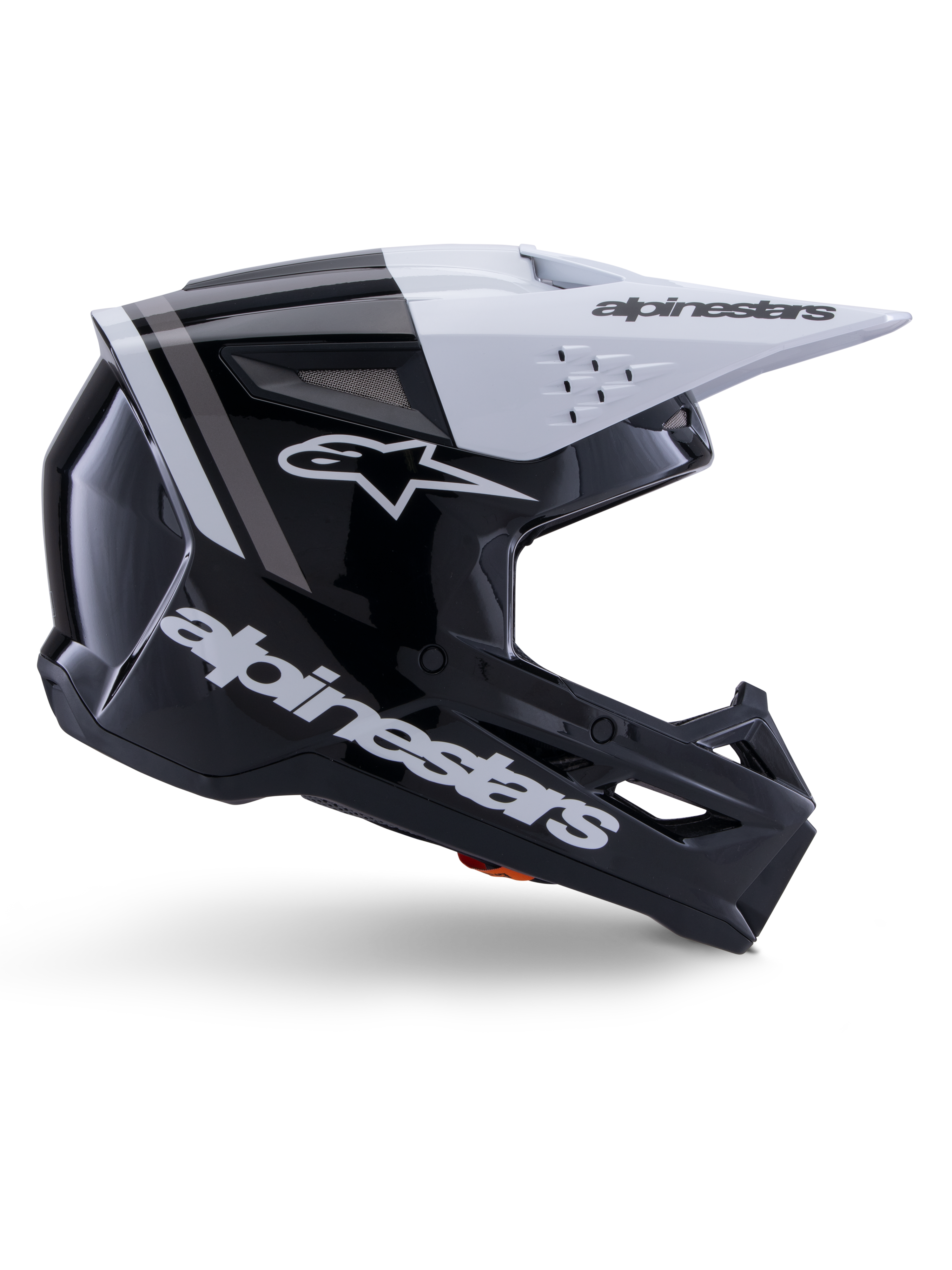 Alpinestars S-M3 Radium Helm, Motocross-Offroad-Helm, Schwarz, Weiß und Grau glänzend, mit einem kantigen aerodynamischen Design und Belüftungsöffnungen, Seitenansicht, glänzende Oberfläche mit grauen Streifen und ein weißes Visier mit Alpinestars-Branding