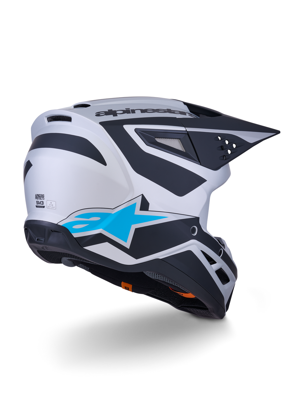 Alpinestars S-M3 Heat Helm ECE 22.06, Motocross-Helm, Silber-Blau und Schwarz Matt, Rückansicht mit großem blauen Stern-Logo und schwarzen kantigen Designs, aerodynamische Schale mit Belüftungsöffnungen, Hochleistungs-Schutz für Offroad-Rennen