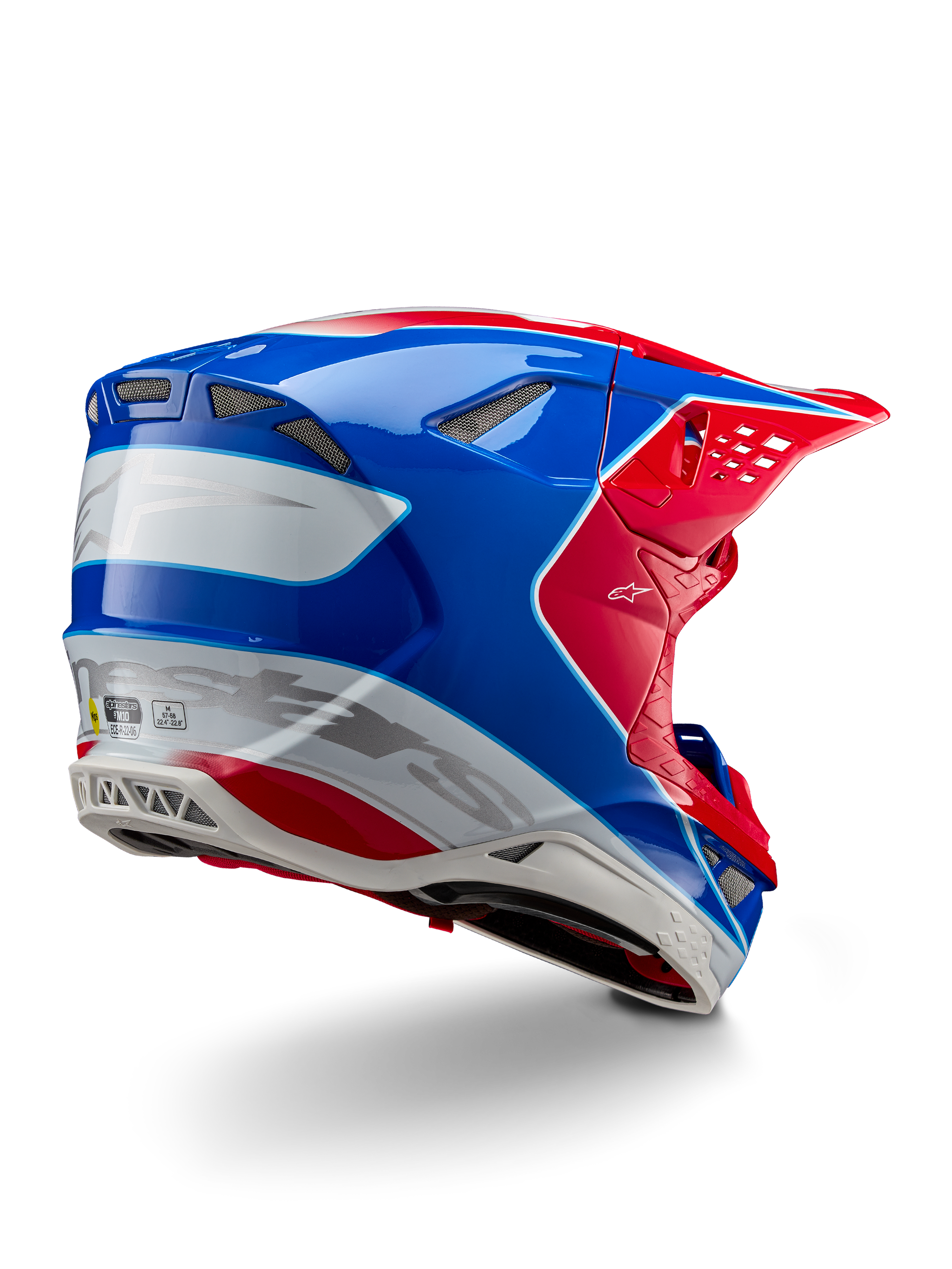 Alpinestars Supertech M10 Aeon ECE 22.06 Helm, Motocross-Helm, Leuchtend Rot, Blau und Weiß Glänzend, Rückseitenansicht mit aerodynamischem Profil, silbernem Alpinestars-Branding und integrierten Belüftungsöffnungen.