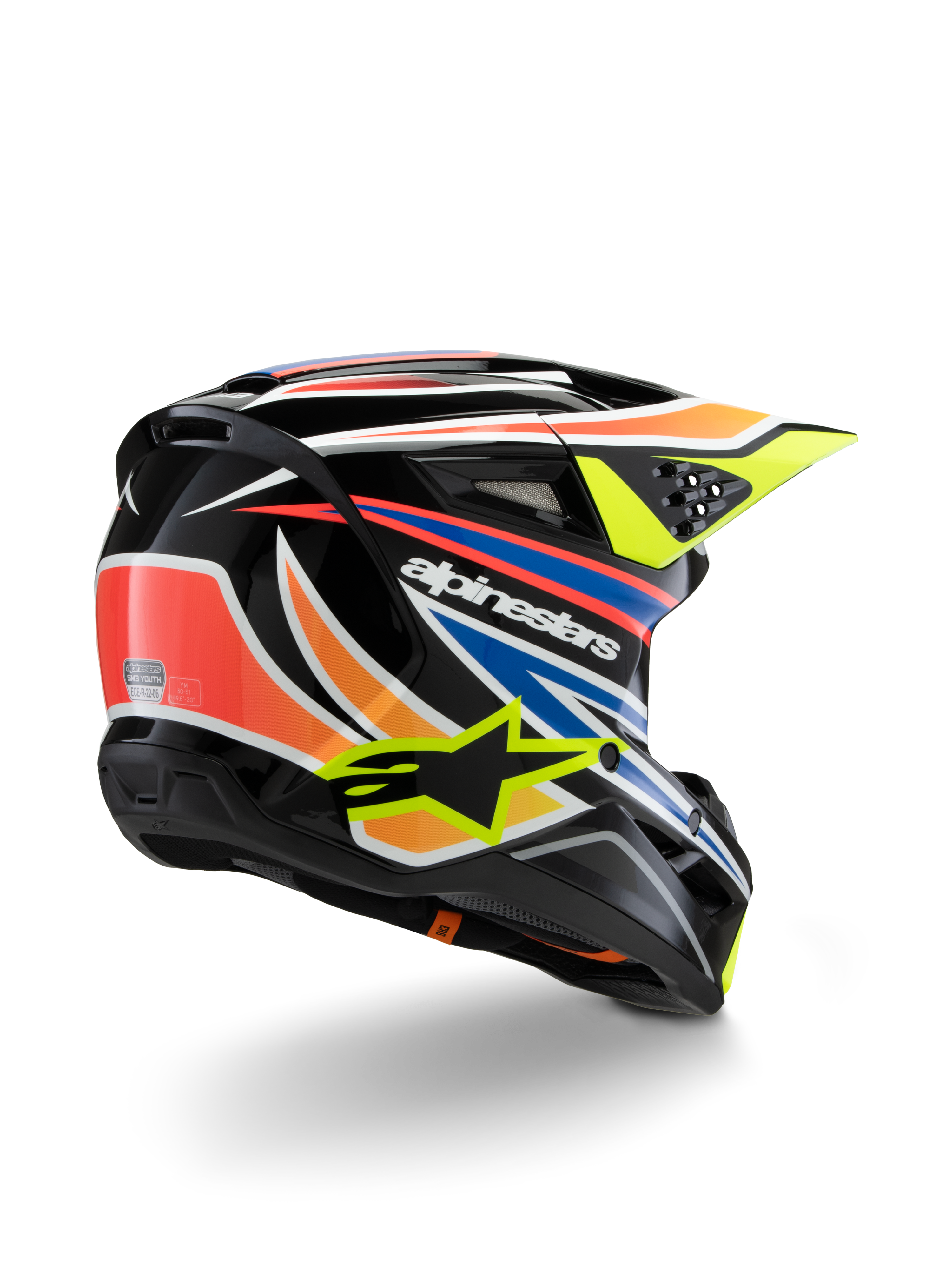 Alpinestars S-M3 Youth Wurx Helm, Jugend-Motocross-Helm, Schwarz mit leuchtend orangen, roten, blauen und fluoreszierend gelben Akzenten, Dreiviertelansicht von hinten zeigt die aerodynamische Schale und Belüftungsöffnungen, glänzendes Finish mit markantem Alpinestars-Branding.