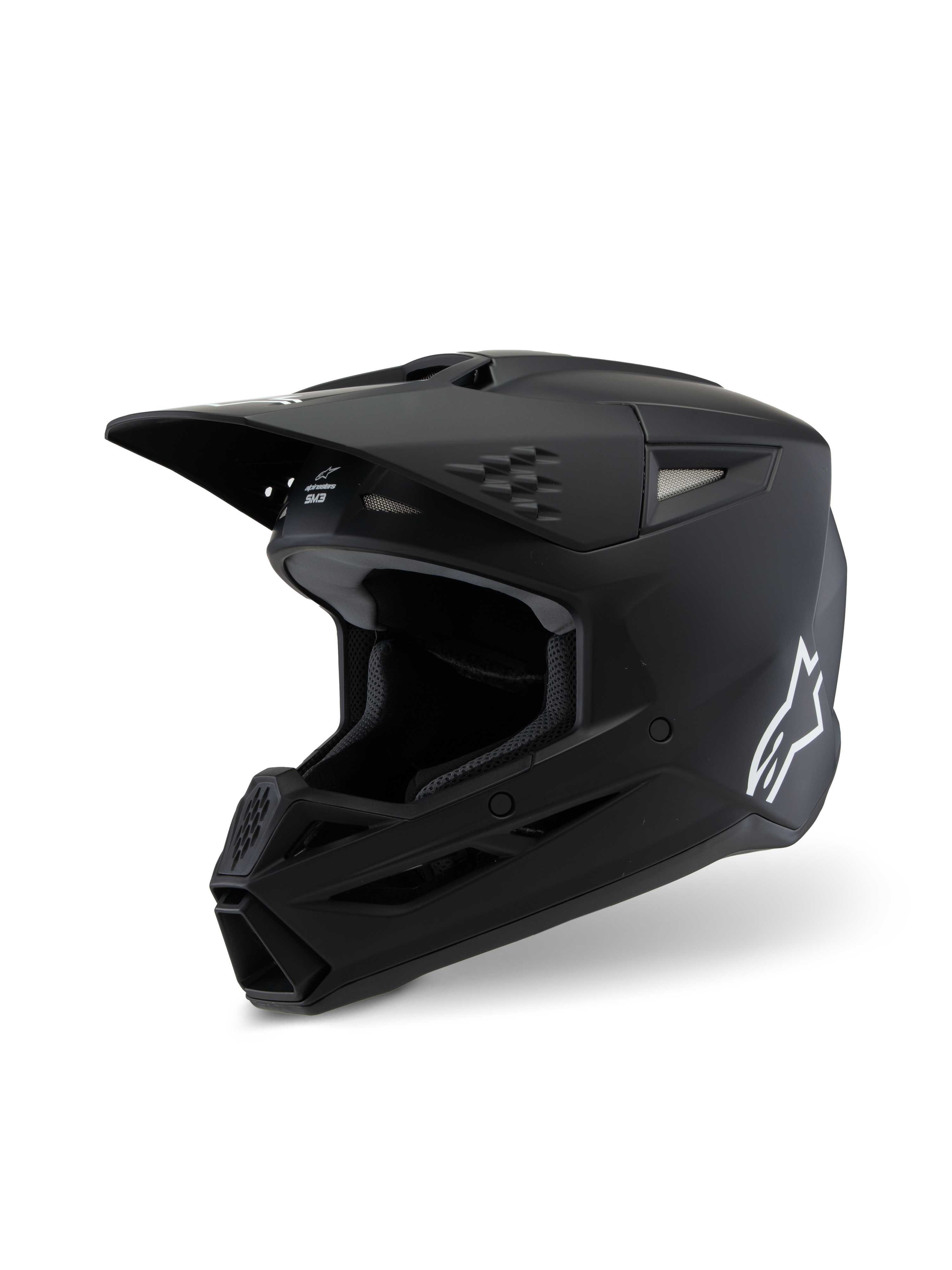 Alpinestars S-M3 Youth Solid Helm ECE 22.06, Motocross-Helm, Mattschwarz, Seitenansicht mit weißem Alpinestars-Logo, aerodynamische Schale mit Belüftungsöffnungen und integriertem Visier, professioneller Offroad-Kopfschutz für junge Fahrer