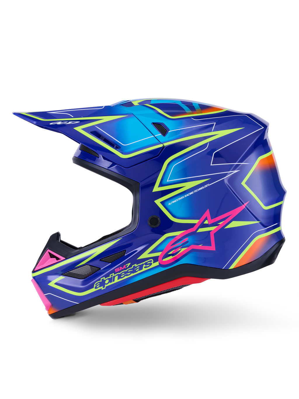 Alpinestars S-M7 Cast Helm, Motocross-Helm, Blau mit pinkfarbenen und neongelben glänzenden Akzenten, Seitenansicht mit aerodynamischer Verbundschale, integrierten Belüftungsöffnungen, pinkfarbenem Stern-Logo und gelbem Branding, entwickelt für Schutz im Offroad-Rennsport.