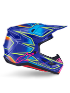 Alpinestars S-M7 Cast Helm, Motocross-Helm, Blau, Pink und Gelb Fluo glänzend, Seitenprofil mit markanten geometrischen Mustern, pinkfarbenem Alpinestars-Logo und belüfteter aerodynamischer Schale.