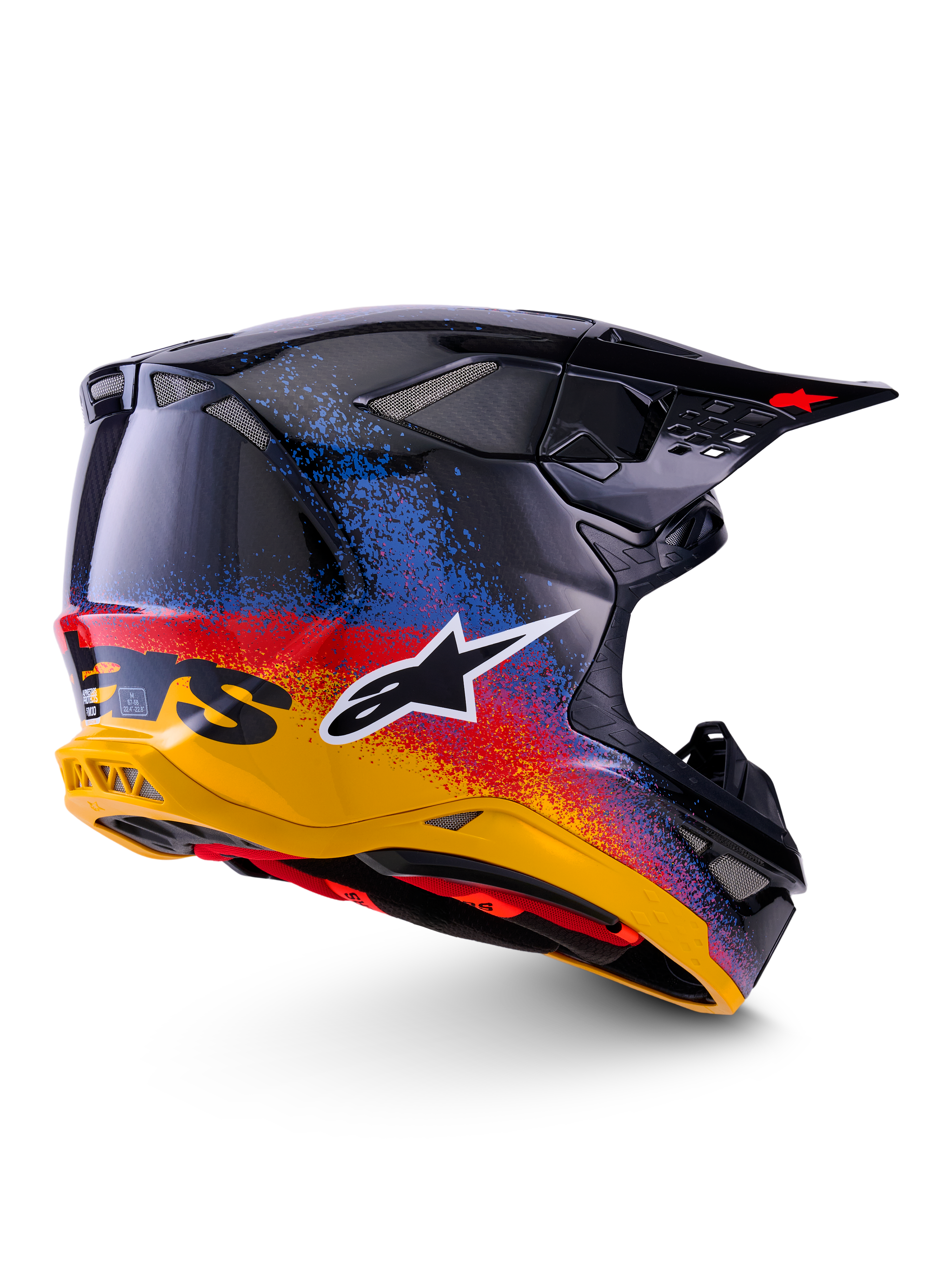 Alpinestars Limited Edition Supertech M10 Black Hole Helm, Motocross-Helm, Black Burst Glossy mit einem leuchtenden, gesprenkelten Farbverlauf von Gelb über Rot nach Blau, leichte Carbon-Schale mit weißem A-Star-Logo und integrierten Mesh-Belüftungsöffnungen