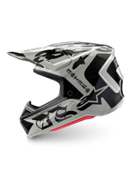 Alpinestars Limited Edition S-M7 Wolf Dust Helm, Motocross-Helm, Dune Black Glossy, off-white Schale mit schwarzem gotischem ASTARS-Branding und grafischen Mustern, rote Innenpolsterung sichtbar, aerodynamisches Profil für den Offroad-Rennsport