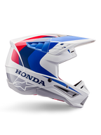 Alpinestars Honda S-M5 Helm ECE, Motocross-Helm, Weiß, Blau und Rot, Seitenprofil-Ansicht, aerodynamisches Design mit integriertem Visier, mehrere Belüftungsöffnungen, glänzendes Finish, markantes Honda-Branding und Alpinestars-Logo