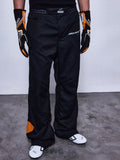 RSRV Arena Suit Pants, Schwarze Rennhose, McLaren und Alpinestars Logos, Orange Patches an der Seite, Orange Kniedetail, Motorsport-Performance-Hose