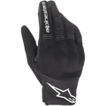 Alpinestars Stella Copper Damen-Handschuhe, schwarz-weiße Motorradhandschuhe, urbaner Stil mit Mesh-Belüftung, weißes Stern-Logo an der Manschette und weißer Text auf dem Zeigefinger, leichte Textilkonstruktion.