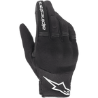 Alpinestars Stella Copper Damen-Handschuhe, schwarz-weiße Motorradhandschuhe, urbaner Stil mit Mesh-Belüftung, weißes Stern-Logo an der Manschette und weißer Text auf dem Zeigefinger, leichte Textilkonstruktion.