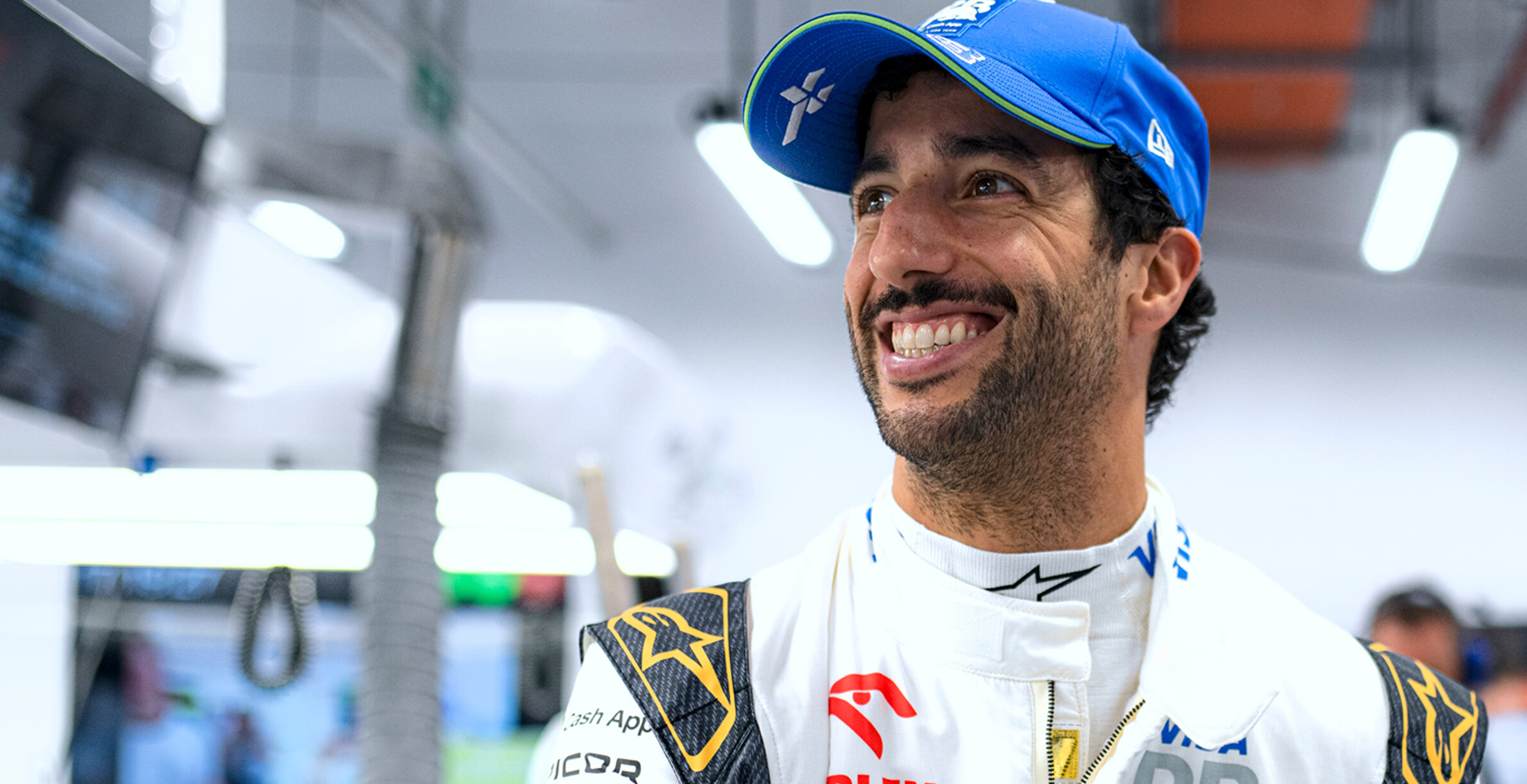 Daniel Ricciardo smiling in the pits