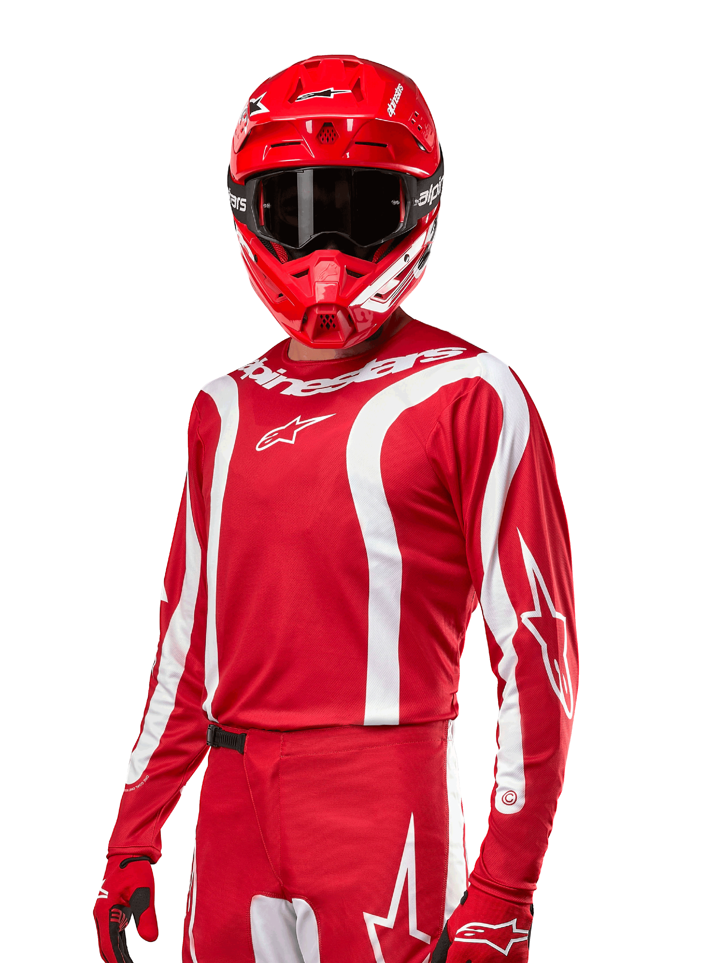 Alpinestars 2024 Fluid Lurv Trikot, Motocross-Renntrikot, Mars-Rot und Weiß, getragen mit passendem rotem Helm und Handschuhen, markantes sportliches Design mit weißen geschwungenen Streifen und Alpinestars-Branding