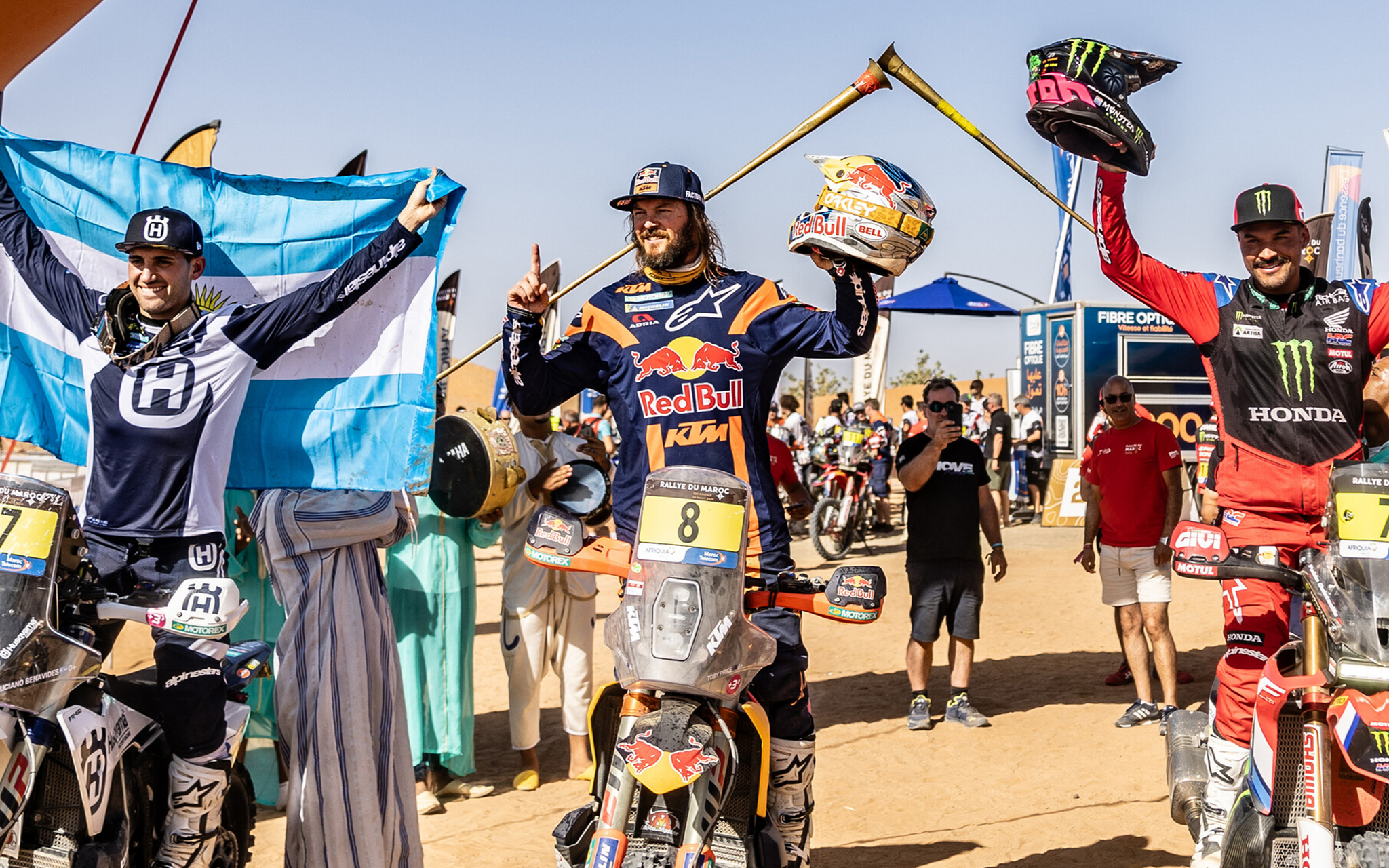 Pablo Quintanilla and other rally athletes celebrating at the finish of a race