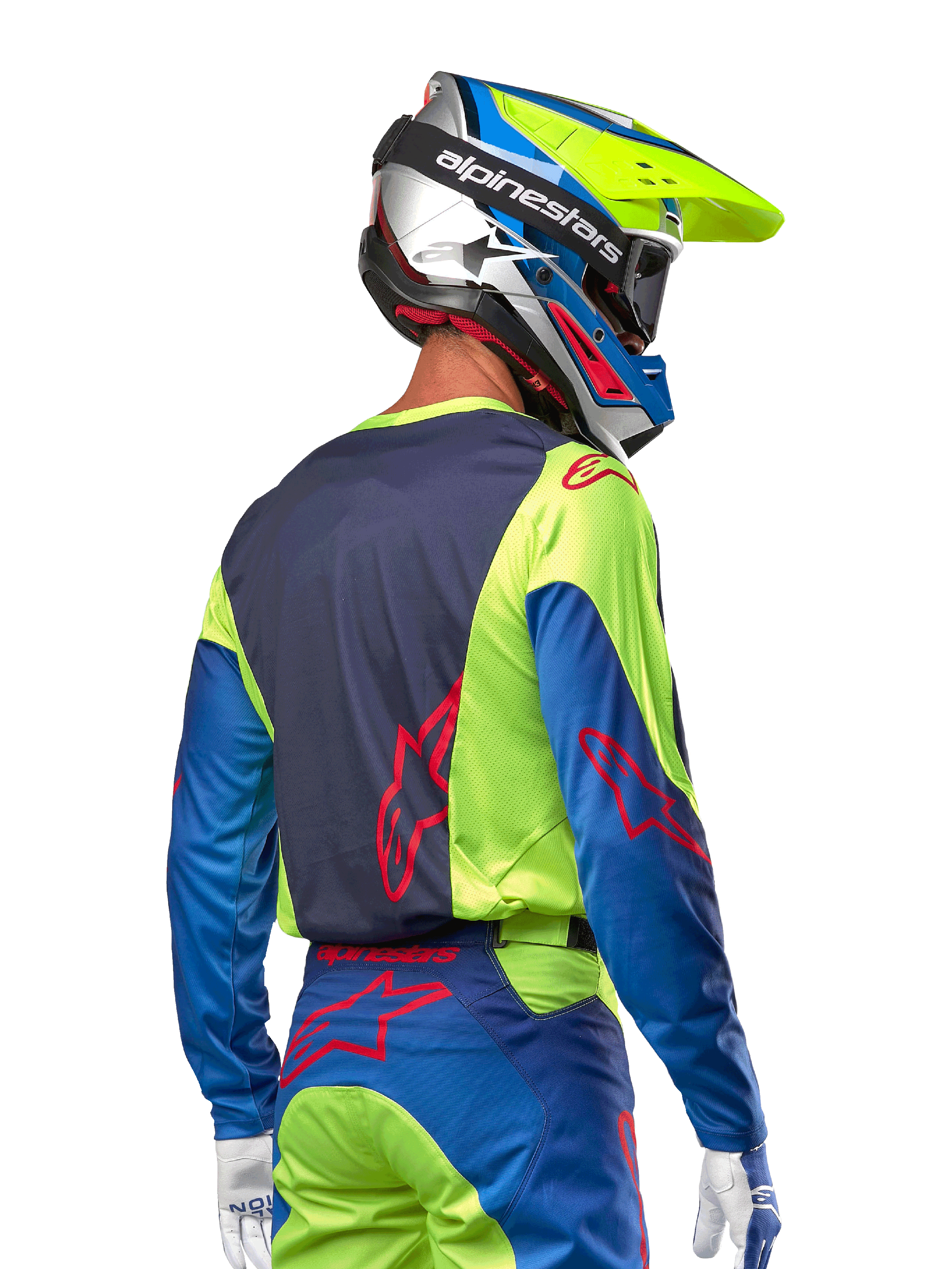 Motocross-Fahrer im Alpinestars 2024 Racer Hoen Trikot in Yellow Fluo und Blue Night Navy, mit einem roten Stern-Logo auf dem Rücken, passender Motocross-Hose und abgestimmtem Rennhelm, Rückansicht zur Darstellung des ergonomischen Designs für Offroad-Performance.
