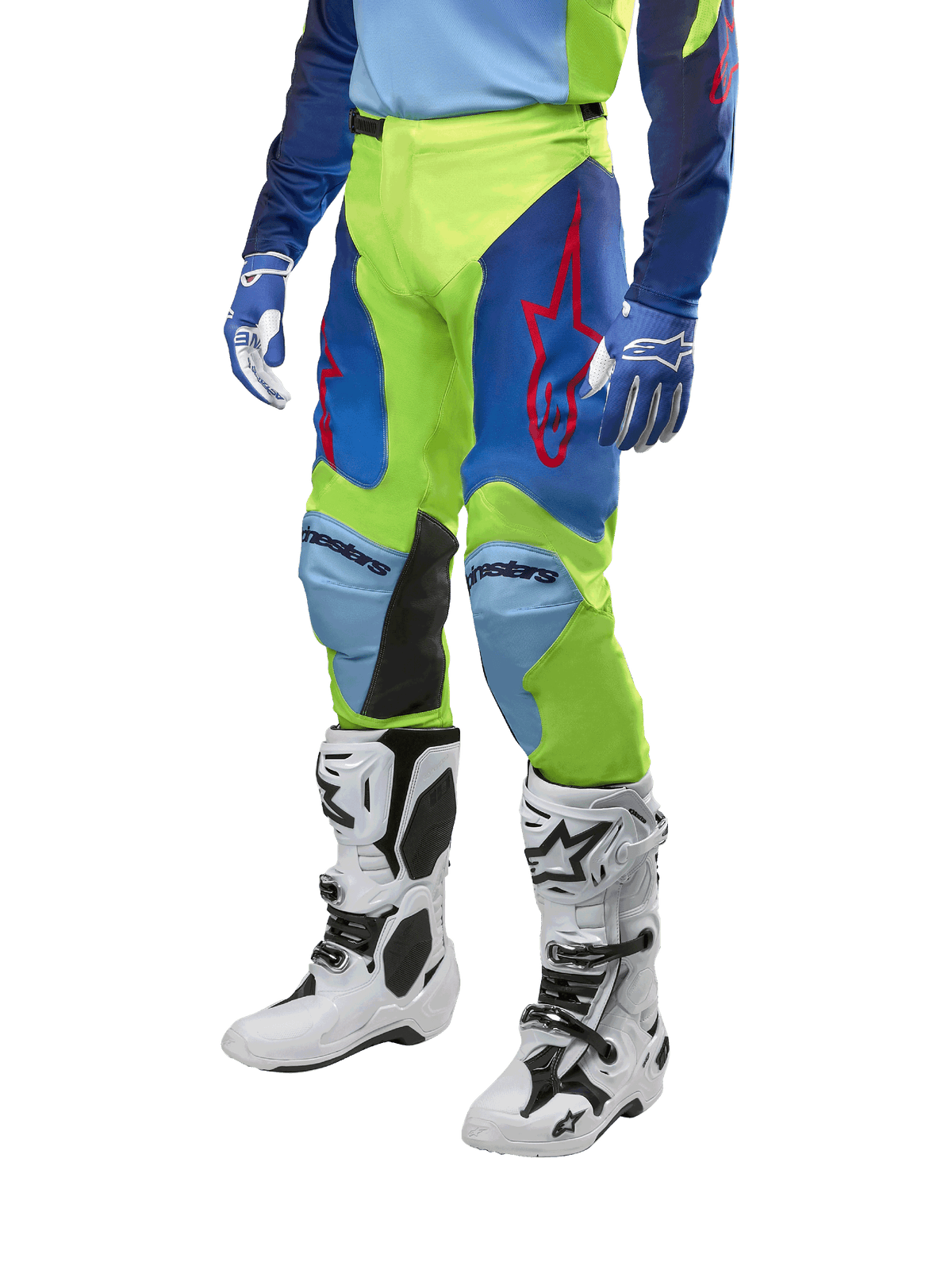 Alpinestars 2024 Racer Hoen Hose, Motocross-Hose, Neongelb und Nachtblau, mit roten Sternlogos und schwarzen Knie-Innenpaneelen, getragen mit passendem Trikot und weißen Motocross-Stiefeln, Performance-Ausrüstung für Offroad-Rennsport