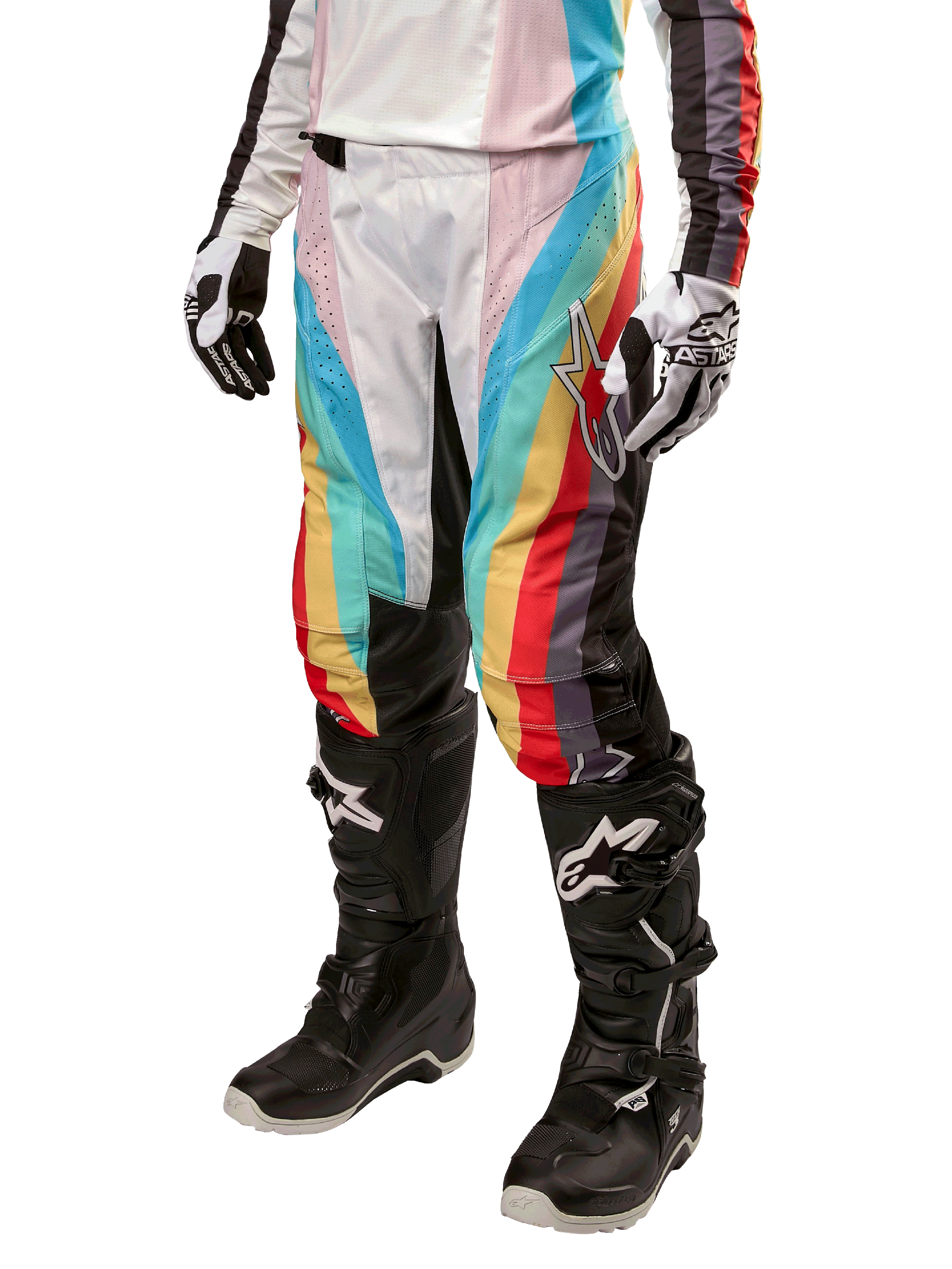 Alpinestars Women Stella 2024 Techstar Pants, Motocross Pants, Black Multicolor with diagonal red, yellow, and blue stripes, worn with black riding boots and white gloves, featuring protective black knee panels and bold branding for off-road racing.