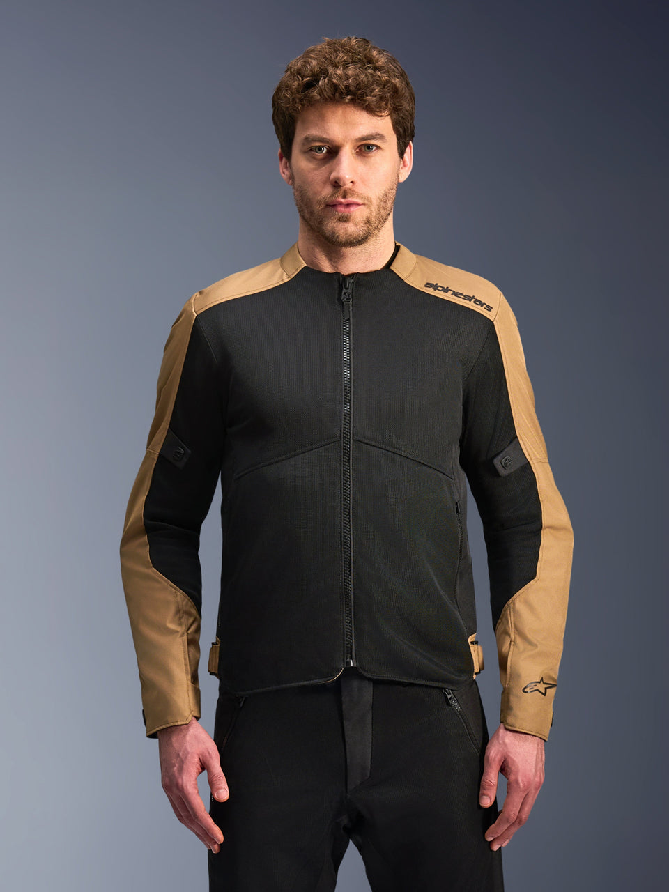 Alpinestars C-1 Air Jacket, Sand and Black motorcycle jacket, featuring large tech mesh ventilation panels and sand-colored polyfabric on the shoulders and outer sleeves, Alpinestars branding on the left shoulder, urban touring style for warm weather riding.