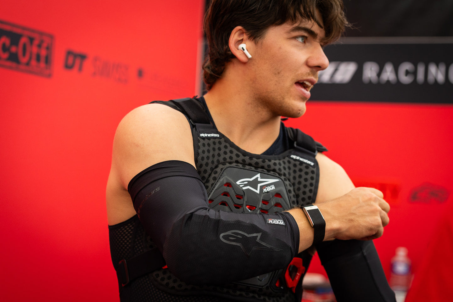 Finn Iles in the paddock wearing Alpinestars plasma chest protector