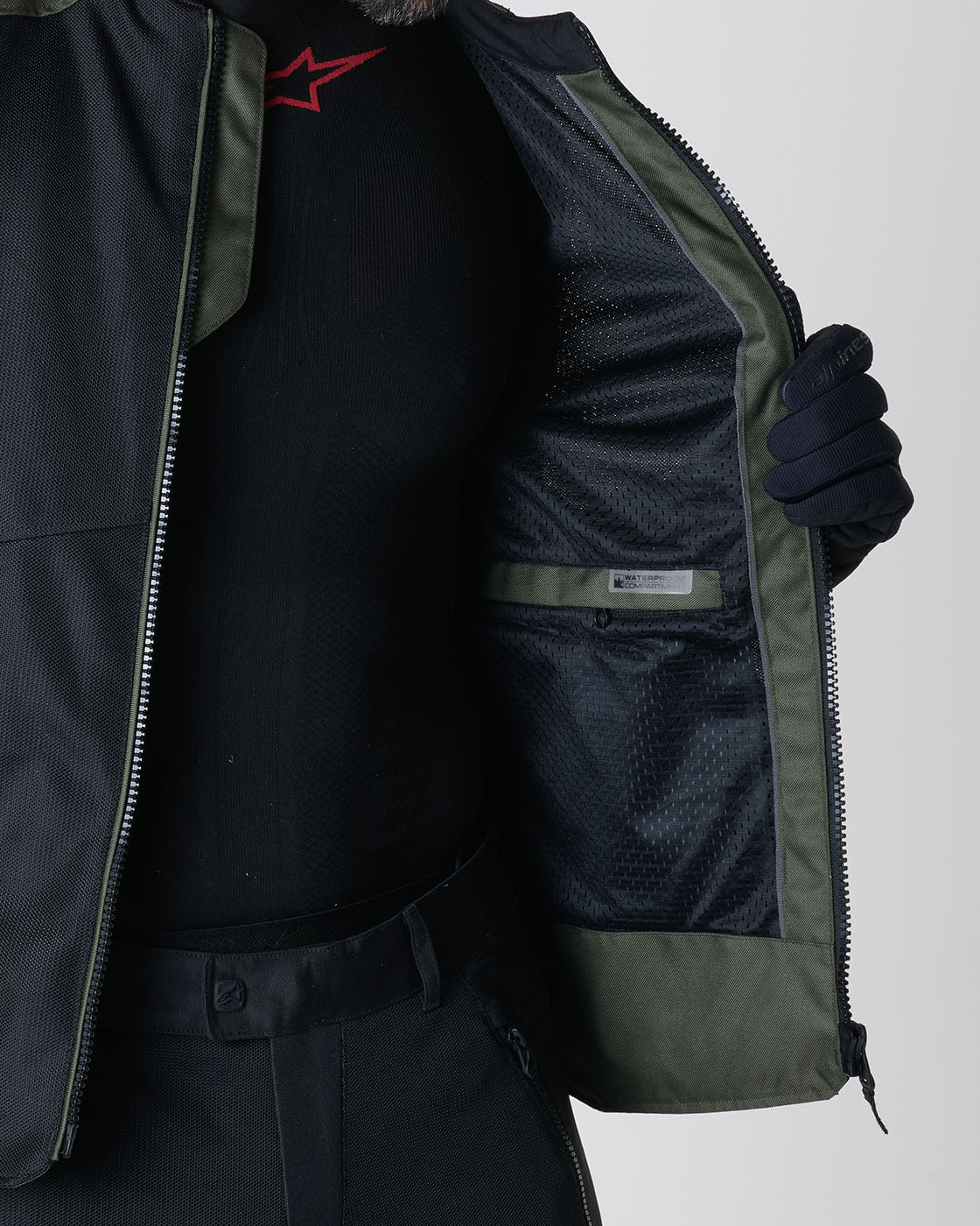 Alpinestars C-1 Air Jacket in black and khaki featuring a waterproof inner pocket for urban motorcycle commuting.