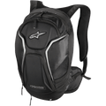 Alpinestars Tech Aero Backpack, Motorcycle Riding Backpack, Black with White and Silver accents, aerodynamic profile with padded anatomical shoulder straps, multiple zippered compartments, mesh side pockets, and reflective piping