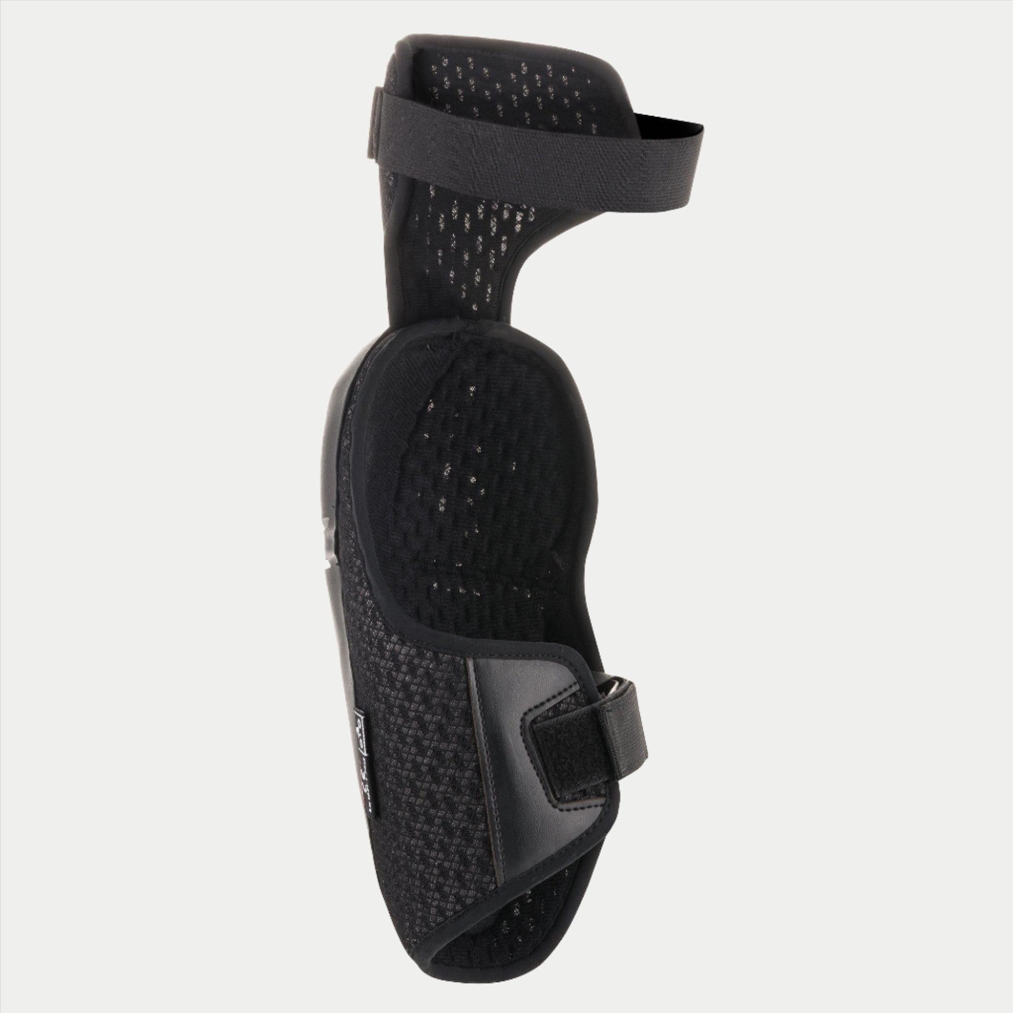 Alpinestars Jugend-Bionic Plus Knieprotektor, Schwarz, zeigt das Mesh-Innenfutter und das doppelte Riemenverschlusssystem, ergonomisches Design für Offroad-Motocross-Schutz